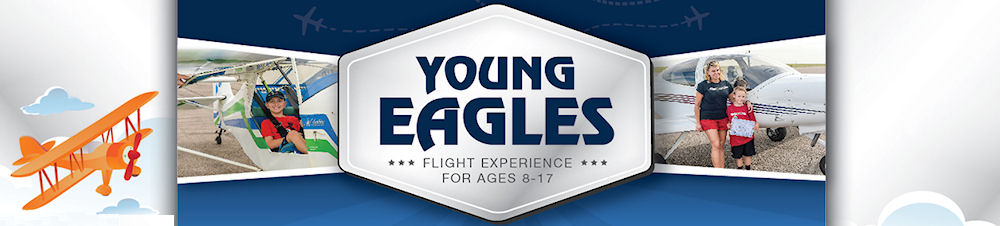 Young people gathered around an aircraft in a hangar learning about aviation